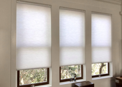 White light filtering cellular honeycomb shades installed on home windows in Alabama - Beach Blinds window coverings