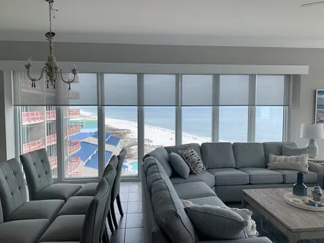 Light filtering solar roller shades installed on large beach condo windows in Alabama - Beach Blinds window coverings