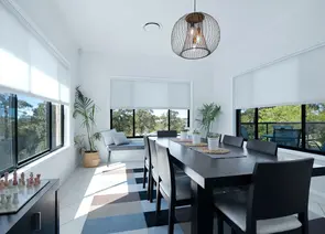 White light filtering cellular honeycomb shades in modern dining room - Beach Blinds Alabama window coverings