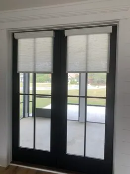 Light filtering white cellular honeycomb shades installed on French doors in Alabama home - Beach Blinds window coverings