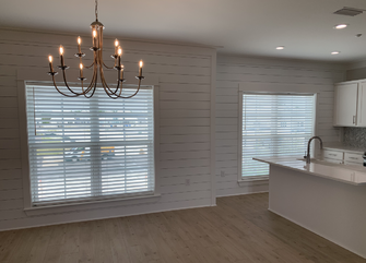 White faux wood horizontal blinds installed on kitchen and dining room windows in Alabama home - Beach Blinds window coverings